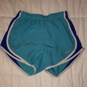 Blue nike shorts.